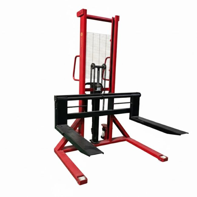 Manual hand truck transporting goods in a manufacturing plant